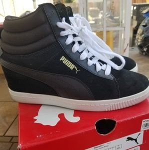 Puma high top wedge tennis shoes